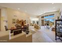 Expansive great room with dining and living areas, large windows offering scenic views and seamless indoor-outdoor living at 11099 E Desert Vista Dr, Scottsdale, AZ 85255