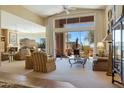 Bright living room featuring comfortable seating, large windows with scenic views, and an open, airy layout at 11099 E Desert Vista Dr, Scottsdale, AZ 85255