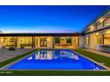 Stunning backyard pool with modern architecture and spacious outdoor living area at 11649 N Miller Rd, Scottsdale, AZ 85260