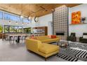 Bright living room with high ceilings, fireplace and modern furniture at 11649 N Miller Rd, Scottsdale, AZ 85260