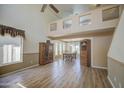 Bright living room with a high ceiling, wood floors and large windows at 1720 W Orchid Ln, Chandler, AZ 85224