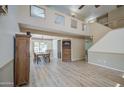 Bright living room with a view to the dining room, wood floors and neutral walls at 1720 W Orchid Ln, Chandler, AZ 85224