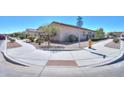Street corner view of a neighborhood with sidewalks and desert landscaping at 2623 E Marcos Dr, Casa Grande, AZ 85194