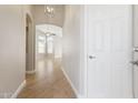 Bright entryway with an arched doorway, wood-look flooring, and neutral color scheme at 3321 N Silverado --, Mesa, AZ 85215
