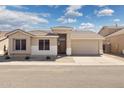 Charming single-story home with desert landscaping, inviting entry, and attached two-car garage at 3321 N Silverado --, Mesa, AZ 85215