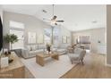 Bright, open living area with vaulted ceiling, fan, and sliding door to the backyard at 3321 N Silverado --, Mesa, AZ 85215