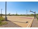 Outdoor basketball court with trees and landscaping surrounding it at 4131 E Kolin Ln, San Tan Valley, AZ 85143
