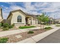 Well maintained home featuring desert landscaping, green turf, and a welcoming front entryway at 4164 E Bernice St, Gilbert, AZ 85295