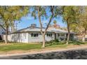 Charming home surrounded by mature trees, offering a serene ambiance and picturesque views at 4332 E Calle Redonda St, Phoenix, AZ 85018