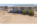 Charming single-story home with a cozy covered porch and desert landscaping at 49853 W Jean Dr, Maricopa, AZ 85139