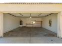 Spacious two-car garage offering ample storage and shelving at 5057 E Dragoon Ave, Mesa, AZ 85206