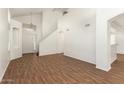 Bright living room showcasing wood-look floors, high ceilings, and natural light at 5057 E Dragoon Ave, Mesa, AZ 85206