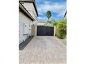 Spacious brick driveway and side yard featuring a secure fence at 5622 W Cavedale Dr, Phoenix, AZ 85083