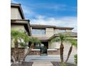 Inviting two-story home featuring desert landscaping, stone accents and a paved driveway at 5622 W Cavedale Dr, Phoenix, AZ 85083