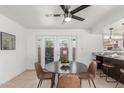 Casual dining area featuring modern fan, granite countertop, and access to patio at 8443 E Montebello Ave, Scottsdale, AZ 85250