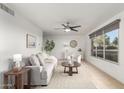 Bright living room featuring neutral paint, tile floors, and lots of natural light at 8443 E Montebello Ave, Scottsdale, AZ 85250