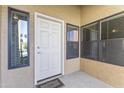 The front door features two sidelight windows and a warm welcome to invite you in at 8787 E Mountain View Rd # 2016, Scottsdale, AZ 85258