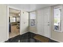 An inviting entryway features a black and white tile floor and a bedroom and backyard view at 8787 E Mountain View Rd # 2016, Scottsdale, AZ 85258
