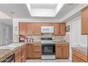 Traditional kitchen boasting oak cabinets, tile backsplash, and modern appliances at 4302 E Mountain Vista Dr, Phoenix, AZ 85048