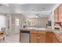 Open-concept kitchen and living room featuring a cozy fireplace at 4302 E Mountain Vista Dr, Phoenix, AZ 85048