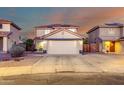 Charming two-story home with a well-manicured lawn and spacious two car garage on a beautifully landscaped lot at 12229 N 121St Dr, El Mirage, AZ 85335