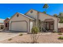 Charming single-Gathering home with desert landscaping and a two-car garage on a clear day at 1449 E Kent Ave, Chandler, AZ 85225