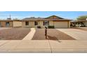 Charming single-story home with a well-maintained front yard and a welcoming walkway at 1619 E Del Rio Dr, Tempe, AZ 85282