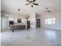 Spacious kitchen featuring a large island, modern appliances, white and wood cabinets, and an open concept at 16405 N Cobblestone Ln, Fountain Hills, AZ 85268