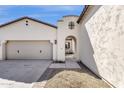 Inviting entrance with an arched doorway and a view of the courtyard at 17002 S 178Th Ave, Goodyear, AZ 85338