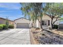 Charming one-story home with well-maintained landscaping and a two-car garage at 17002 S 178Th Ave, Goodyear, AZ 85338