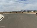 Street view of a street in a neighborhood surrounded by houses and mountains at 17808 W Sanna St, Waddell, AZ 85355
