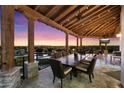 Inviting outdoor patio featuring comfortable seating, a dining area, and a stunning view of the city at 18116 N 14Th St, Phoenix, AZ 85022