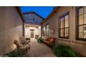 Inviting courtyard with cozy seating, brick pavers, and views of the home's architectural details at 1903 N Lynch --, Mesa, AZ 85207