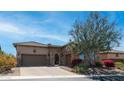 Charming single-story home featuring a stone facade, tile roof, well-manicured landscaping, and a two-car garage at 1903 N Lynch --, Mesa, AZ 85207