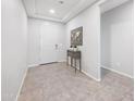 Bright foyer with tile flooring, white walls, and decorative console table at 2167 W Ethan Ct, San Tan Valley, AZ 85144