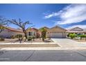 Inviting single-story home with a well-maintained front yard and a spacious driveway at 2375 E Fiesta Dr, Casa Grande, AZ 85194