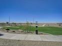 Well-maintained community park with walking paths, green spaces, and desert landscaping at 24215 W Hidalgo Ave, Buckeye, AZ 85326