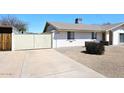 A single-story home with brick accents and low-maintenance landscaping at 2808 E Lupine Ave, Phoenix, AZ 85028