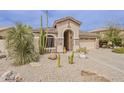 Charming home showcasing stone accents, desert landscaping and a spacious two-car garage at 29322 N Red Finch Dr, San Tan Valley, AZ 85143