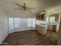 Bright kitchen with stainless steel appliances, light cabinets, and ceiling fan at 3520 N Yucca Dr, Florence, AZ 85132