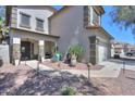 Charming home featuring a welcoming front porch and desert landscaping at 45176 W Alamendras St, Maricopa, AZ 85139