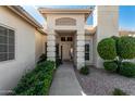 Inviting front entrance with white trim and desert landscaping at 5140 S Tanglewood Dr, Chandler, AZ 85248