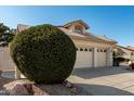 Lovely house with an attached two car garage and desert landscaping in the front yard at 5140 S Tanglewood Dr, Chandler, AZ 85248