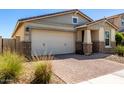 Charming single-story home featuring a brick driveway, a two-car garage, and desert landscaping at 5259 S Hadron --, Mesa, AZ 85212