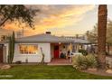 Beautiful home exterior with lush lawn, mature landscaping, and a quaint covered front porch at 536 W Windsor Ave, Phoenix, AZ 85003
