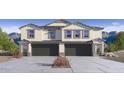 Beautiful new construction home with gray and white colors and two-car garage at 9807 S 11Th St, Phoenix, AZ 85042