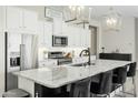 Stylish kitchen features granite counters, stainless appliances, and pendant lighting at 1816 N Bernard Cir, Mesa, AZ 85207