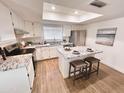 Well-lit kitchen features a functional island, granite countertops, and stainless steel appliances at 2416 W Stottler Dr, Chandler, AZ 85224