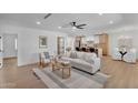 Bright living room featuring a contemporary design and an open concept layout to kitchen at 8215 E Virginia Ave, Scottsdale, AZ 85257
