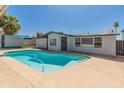 Backyard pool offers a refreshing escape, perfect for relaxation and summer fun at 1112 W Farmdale Ave, Mesa, AZ 85210